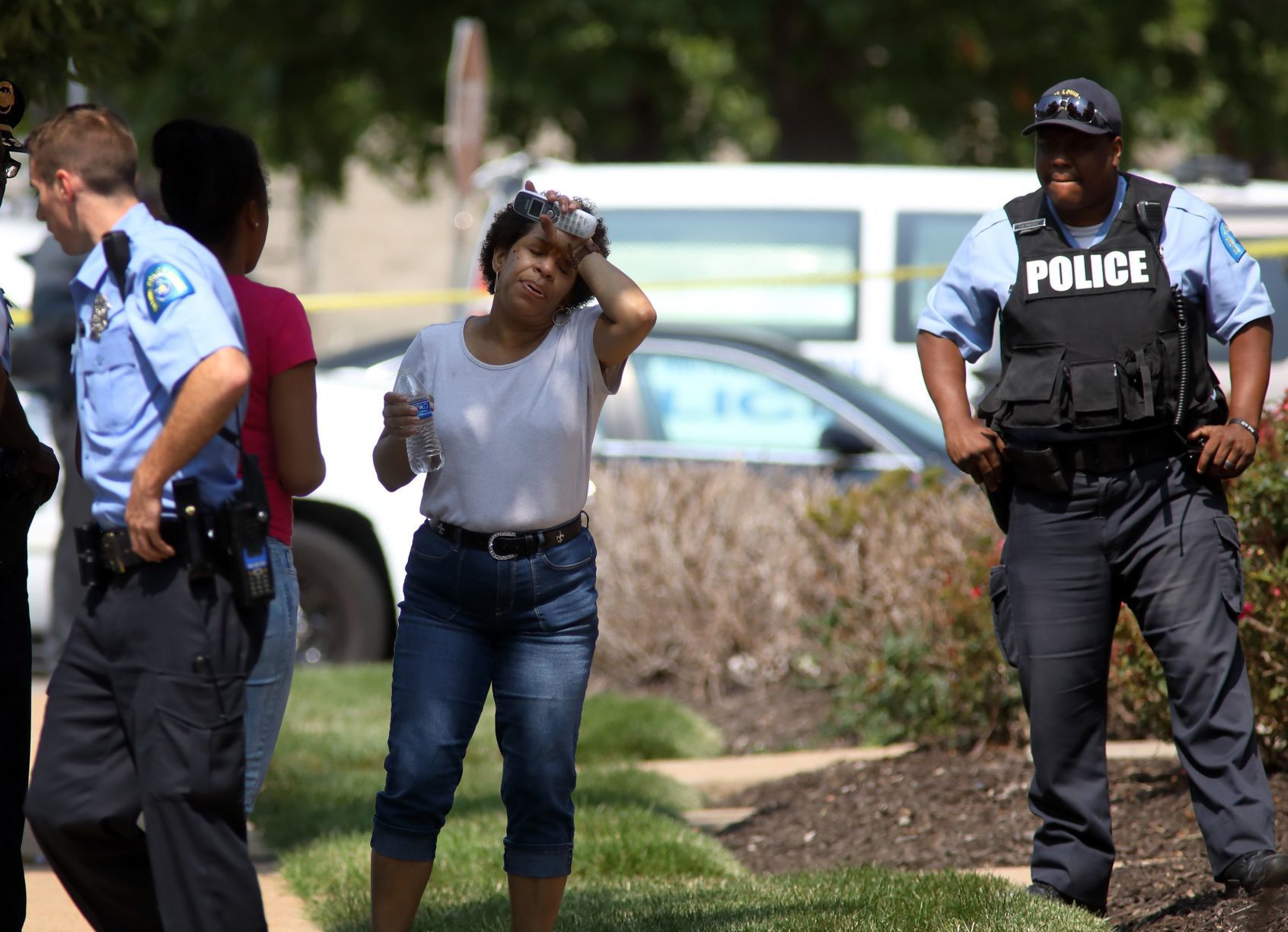 Two officers shot, bystander hit by stray bullet